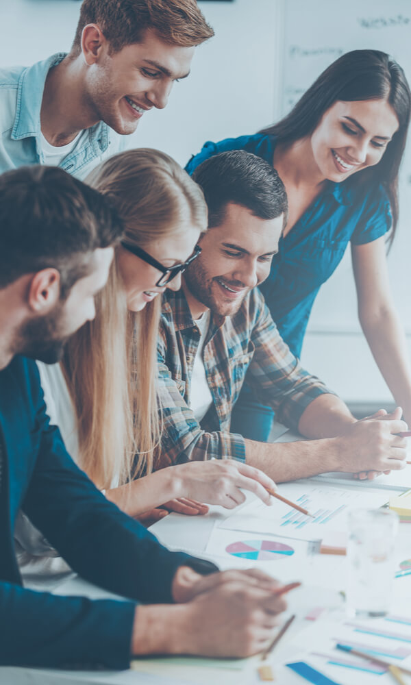 Employees Of A Mobile App Testing Company Demonstrating Their Ability To Work As A Team Employees Of A Mobile App Testing Company Demonstrating Their Ability To Work As A Team
