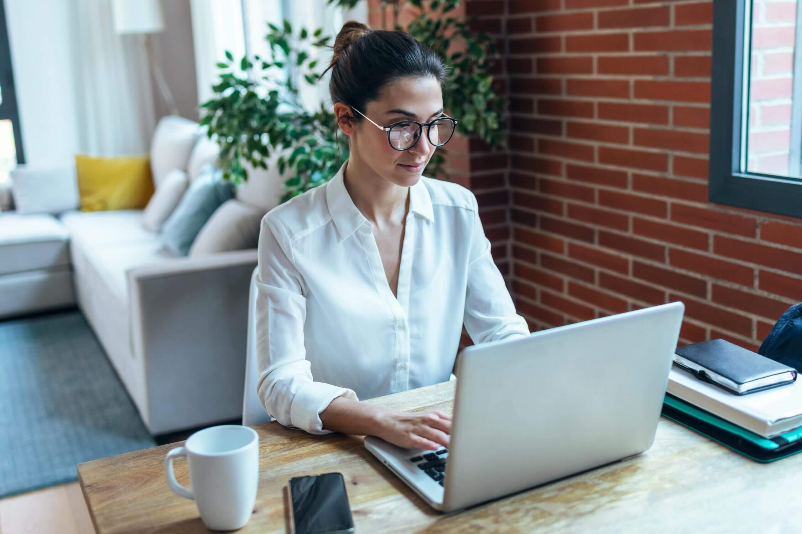 A Women Working On A Laptop For A Mobile Testing Service Provider In India A Women Working On A Laptop For A Mobile Testing Service Provider In India