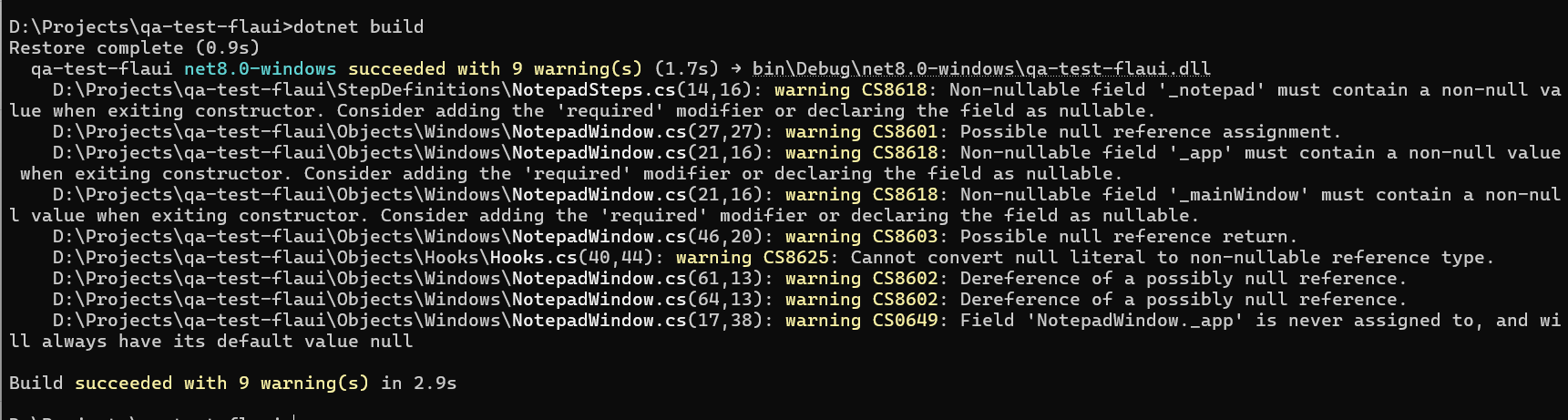 Terminal output showing a successful dotnet build of the qa-test-flaui project
